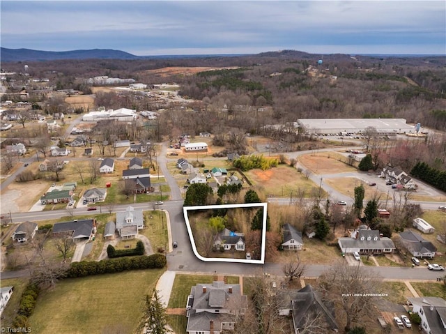 drone / aerial view with a residential view and a mountain view