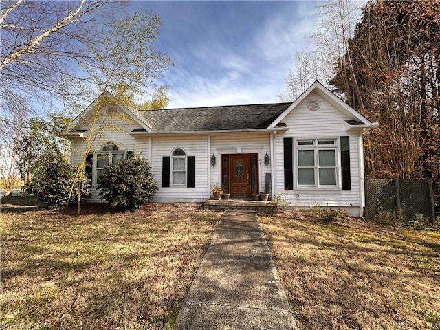 single story home featuring a front lawn