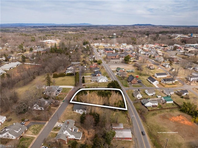 birds eye view of property with a residential view and a mountain view