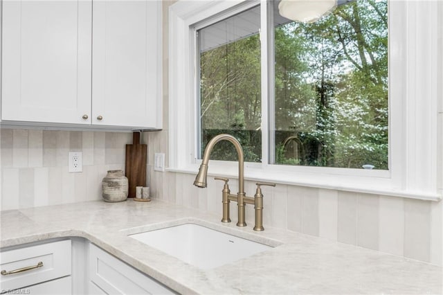 detailed view of a sink and decorative backsplash