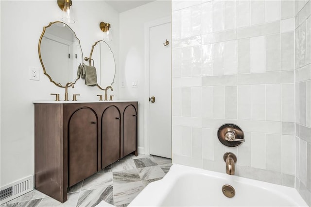 full bathroom with a tub to relax in and double vanity