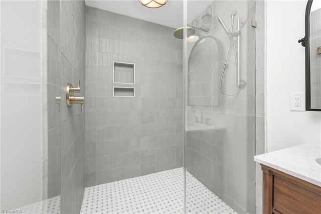 full bathroom featuring vanity and walk in shower