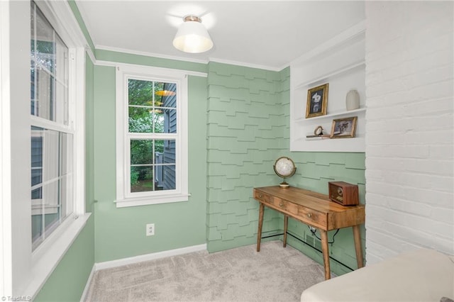 living area featuring carpet flooring, crown molding, and baseboards