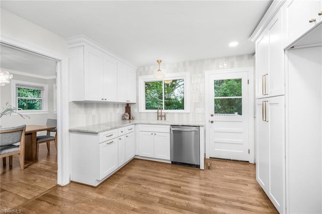 kitchen with dishwasher, a sink, white cabinetry, and light wood finished floors