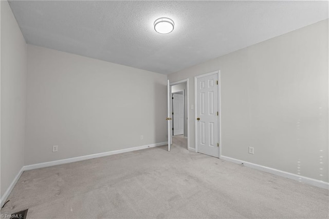 211 Forestview Dr, Elon, NC 27244 - unfurnished bedroom with carpet floors and a textured ceiling