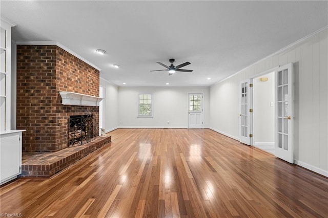 211 Forestview Dr, Elon, NC 27244 - unfurnished living room with crown molding, light wood-style flooring, a ceiling fan, and a fireplace