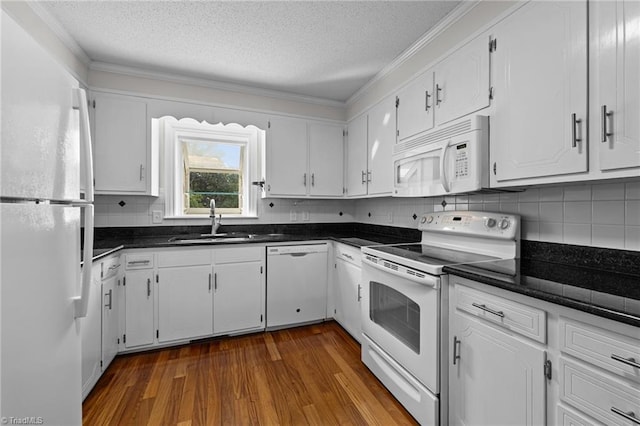 211 Forestview Dr, Elon, NC 27244 - kitchen featuring white appliances, dark countertops, dark wood finished floors, a textured ceiling, and white cabinets