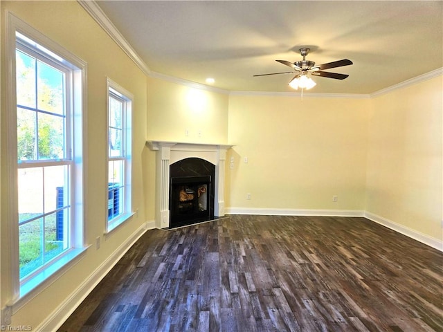 unfurnished living room featuring dark hardwood / wood-style floors, ceiling fan, and ornamental molding