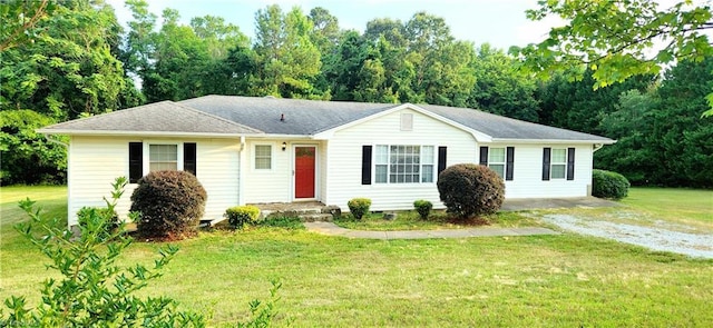 single story home featuring a front lawn