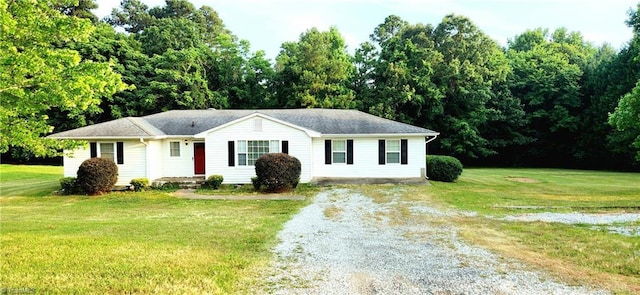 single story home featuring a front yard