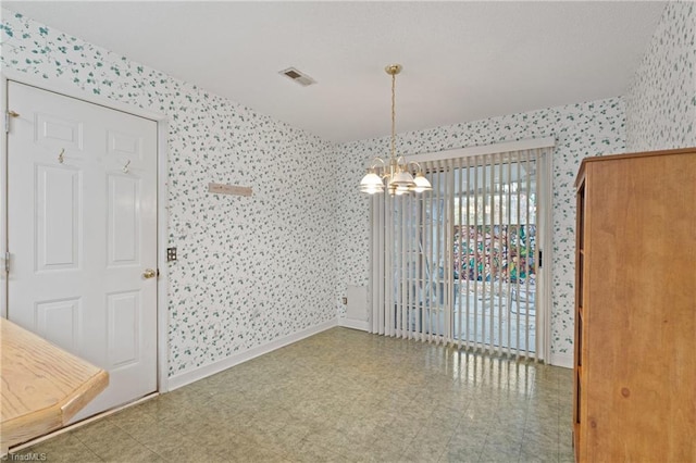 unfurnished dining area with a notable chandelier