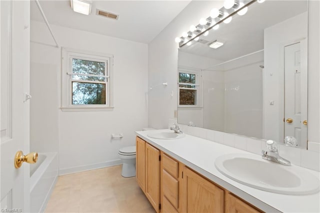 full bathroom with vanity, toilet, and washtub / shower combination