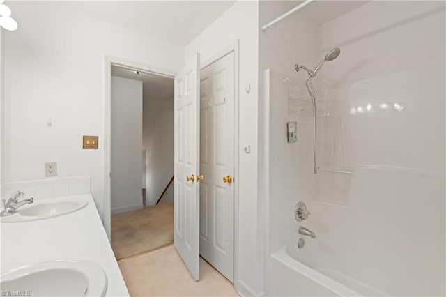 bathroom with tile patterned flooring, vanity, and bathtub / shower combination