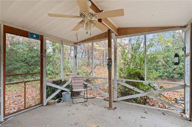 unfurnished sunroom with ceiling fan and vaulted ceiling