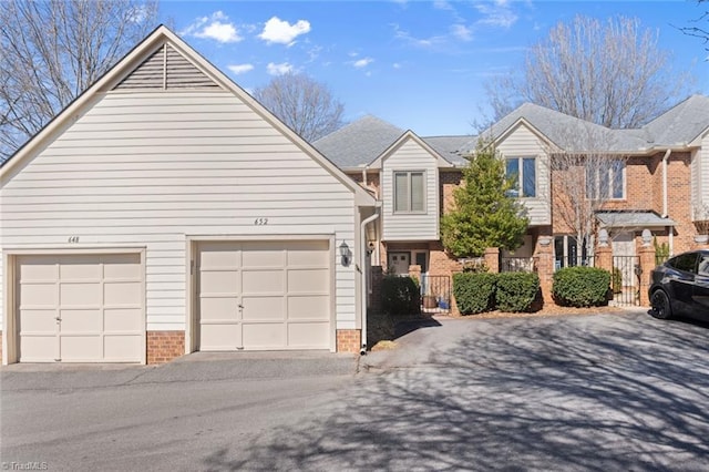 front facade with a garage