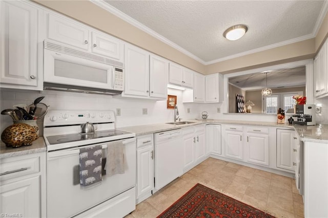 kitchen featuring sink, crown molding, white appliances, white cabinets, and decorative backsplash