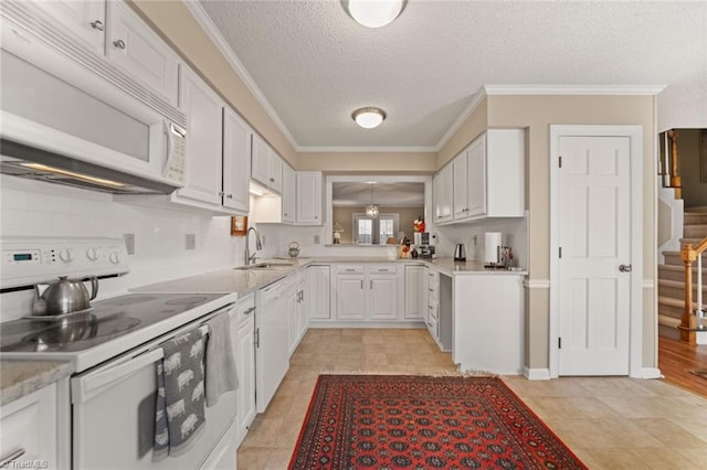 kitchen featuring white cabinetry, sink, white appliances, and ornamental molding