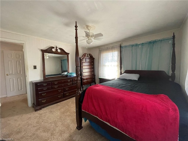 carpeted bedroom with a ceiling fan