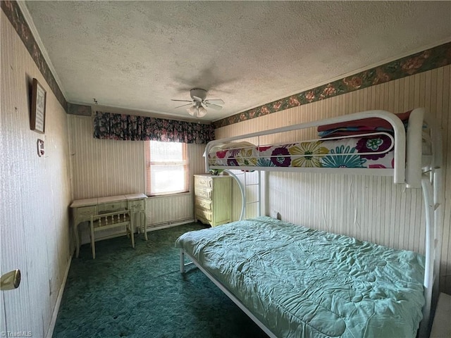 unfurnished bedroom featuring a textured ceiling, ceiling fan, carpet, and wallpapered walls