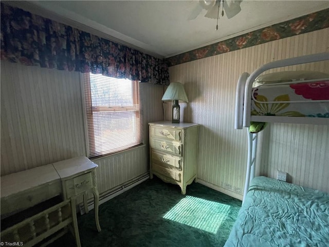 bedroom with dark colored carpet, ceiling fan, and wallpapered walls