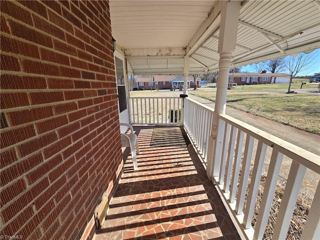 balcony featuring a porch