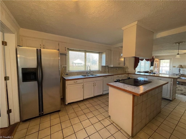 kitchen featuring black electric stovetop, white cabinets, a sink, white dishwasher, and stainless steel fridge with ice dispenser