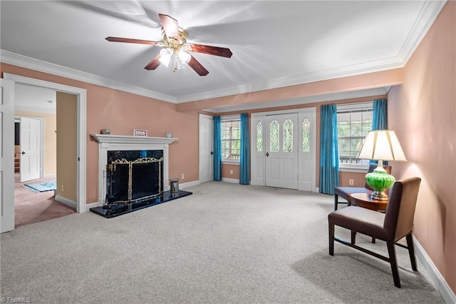 12088 Burlington Rd, Hurdle Mills, NC 27541 - carpeted living area with crown molding, a ceiling fan, baseboards, and a high end fireplace