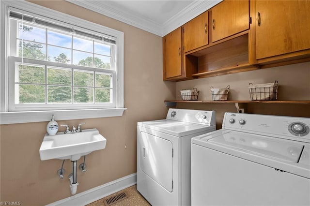 12088 Burlington Rd, Hurdle Mills, NC 27541 - washroom with cabinet space, independent washer and dryer, baseboards, and ornamental molding