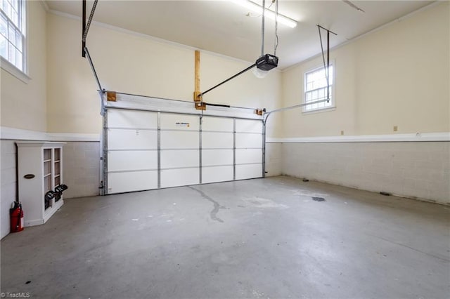 12088 Burlington Rd, Hurdle Mills, NC 27541 - garage featuring concrete block wall and a garage door opener