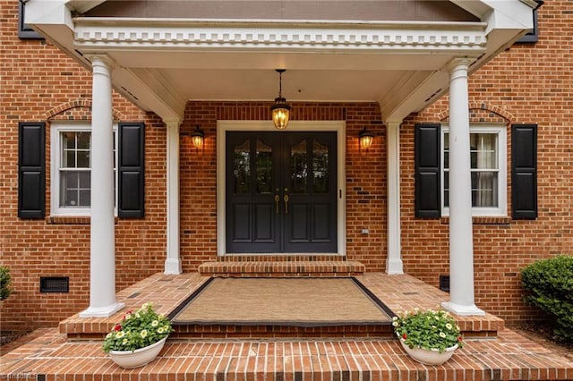 12088 Burlington Rd, Hurdle Mills, NC 27541 - view of exterior entry featuring brick siding