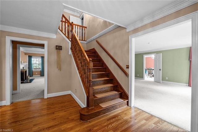 12088 Burlington Rd, Hurdle Mills, NC 27541 - stairs featuring baseboards, ornamental molding, wood finished floors, and carpet