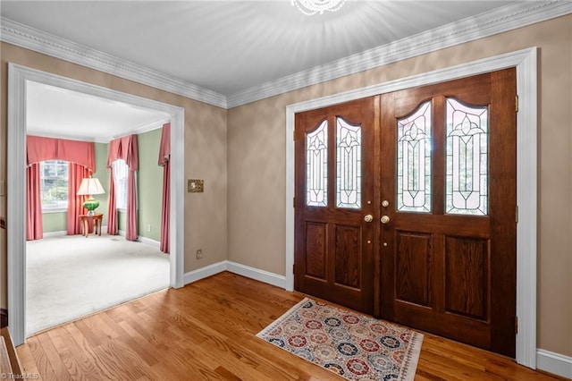 12088 Burlington Rd, Hurdle Mills, NC 27541 - entrance foyer featuring baseboards, wood finished floors, and crown molding