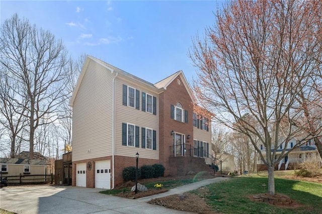 view of home's exterior with concrete driveway, an attached garage, a lawn, and brick siding