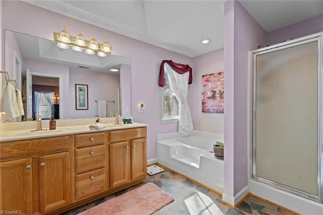 full bath with a wealth of natural light, a stall shower, a garden tub, and double vanity