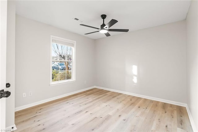 empty room with light hardwood / wood-style floors and ceiling fan