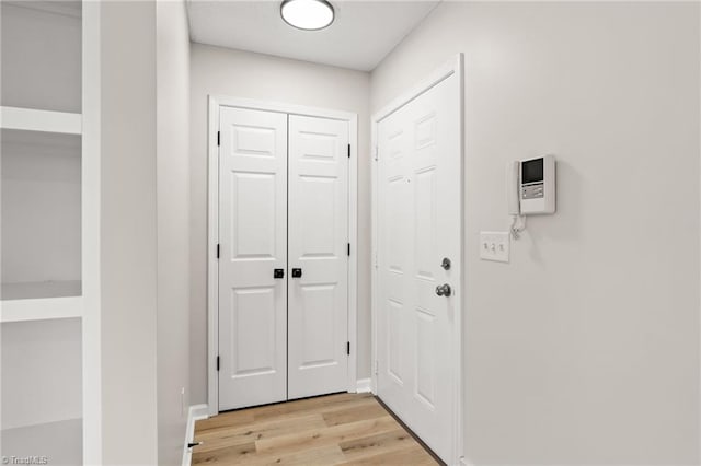 doorway to outside featuring light wood-type flooring