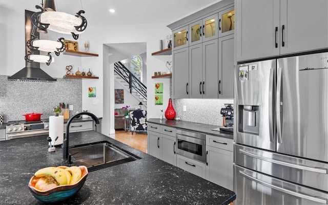 kitchen featuring open shelves, stainless steel fridge, a sink, built in microwave, and decorative backsplash