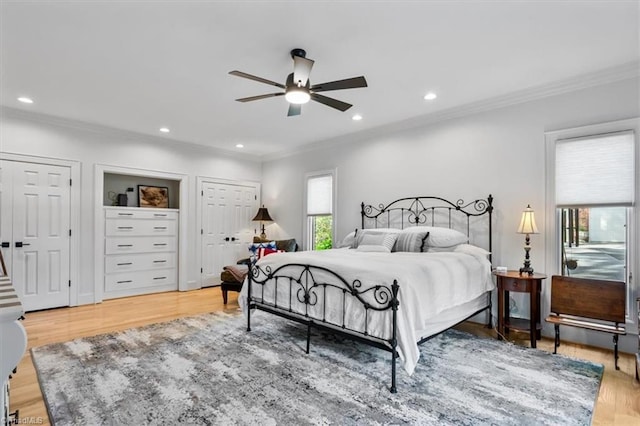 bedroom featuring crown molding, recessed lighting, and light wood finished floors