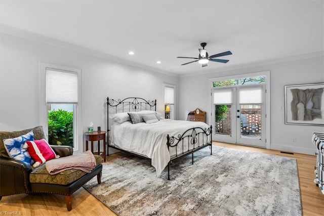 bedroom featuring crown molding, recessed lighting, access to exterior, and light wood-style flooring