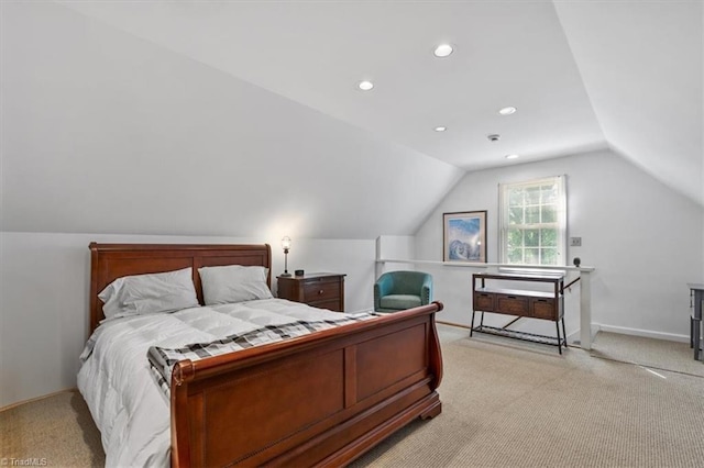 bedroom featuring recessed lighting, vaulted ceiling, and light carpet