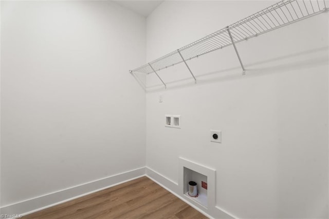 laundry area featuring wood-type flooring, hookup for a washing machine, and hookup for an electric dryer