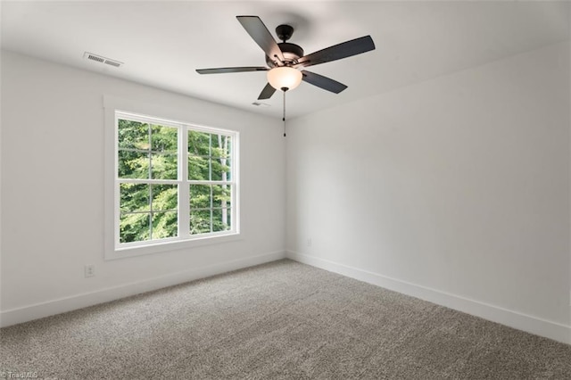 unfurnished room with ceiling fan and carpet floors