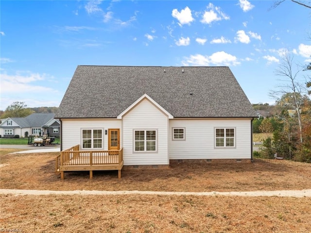 back of house with a wooden deck