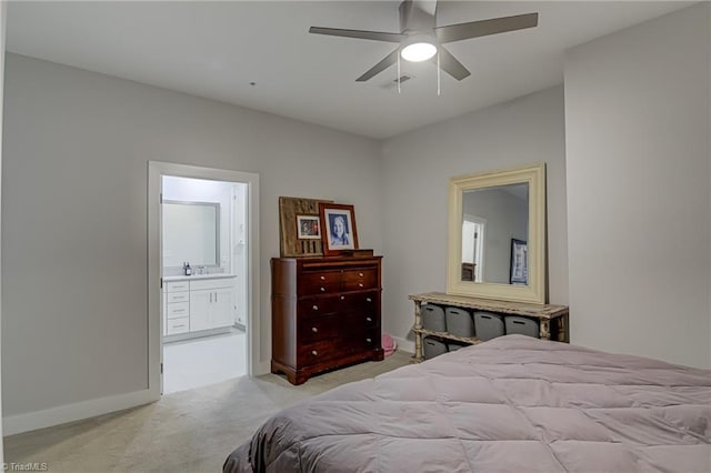 400 W 4th St Unit 401, Winston-Salem, NC 27101 - carpeted bedroom with ensuite bathroom, baseboards, and ceiling fan