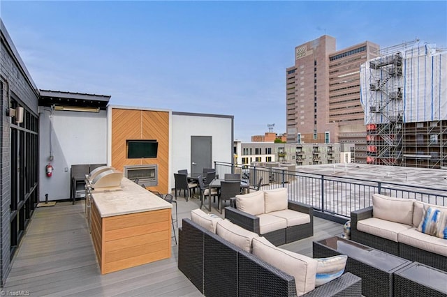 400 W 4th St Unit 401, Winston-Salem, NC 27101 - deck with outdoor lounge area, a view of city, and an outdoor kitchen