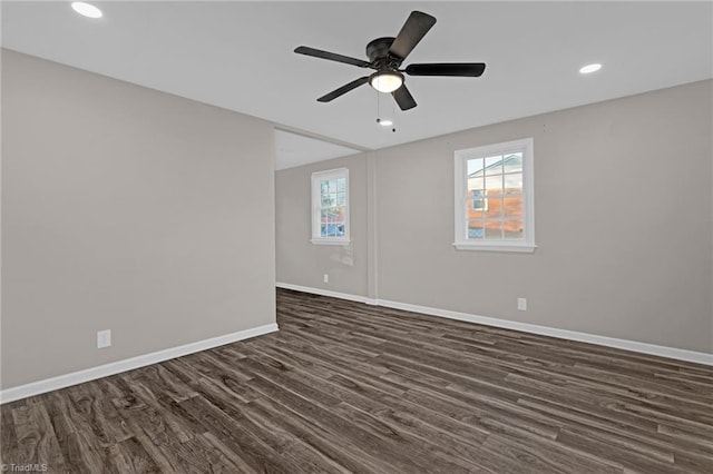 unfurnished room featuring ceiling fan and dark hardwood / wood-style flooring