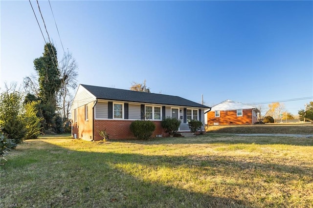 single story home featuring a front yard