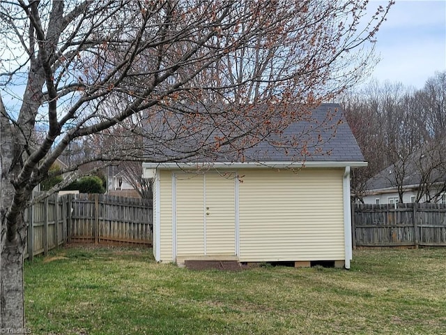 view of shed with a fenced backyard