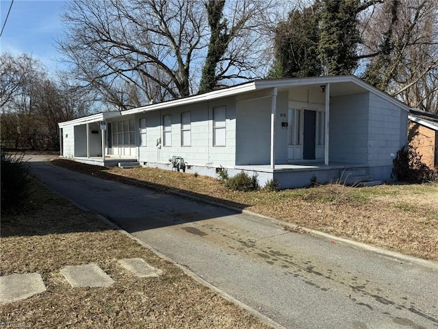 view of front of house featuring covered porch and crawl space