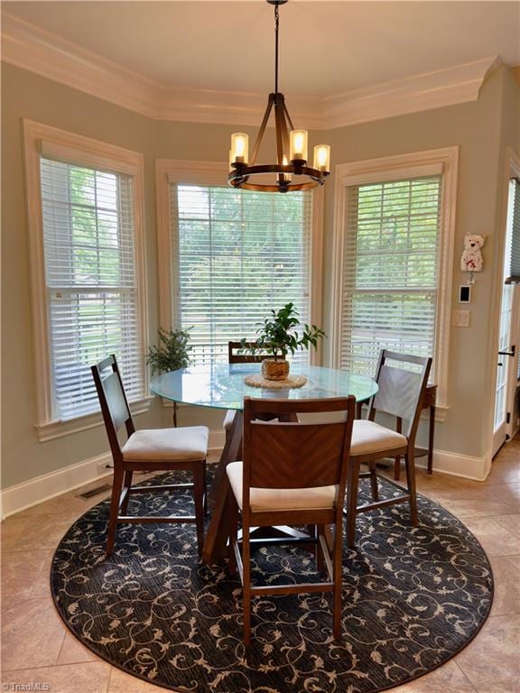 2863 Spencer Rd, Archdale, NC 27263 - dining room with a chandelier, healthy amount of natural light, light tile patterned floors, and ornamental molding